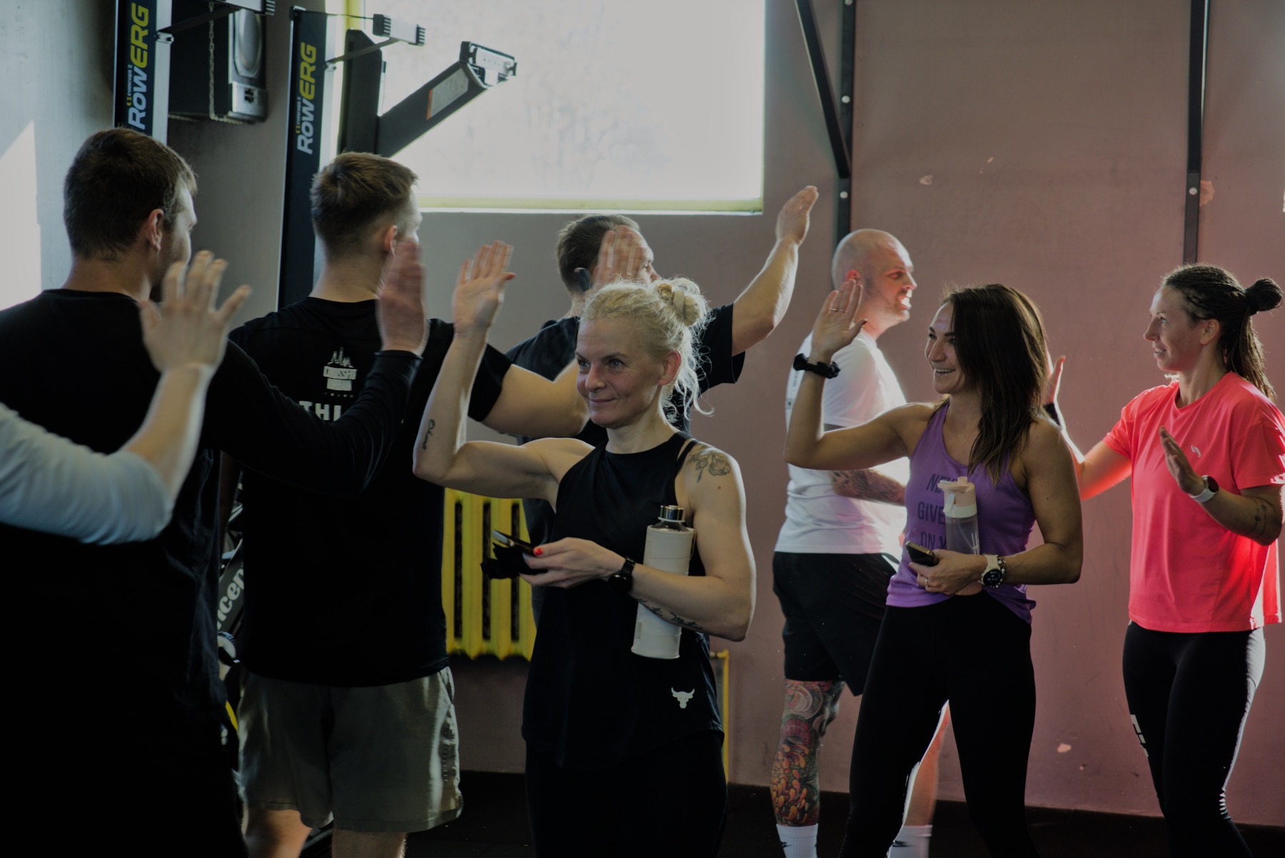 CrossFit Urban Tribe members high-fiving after training